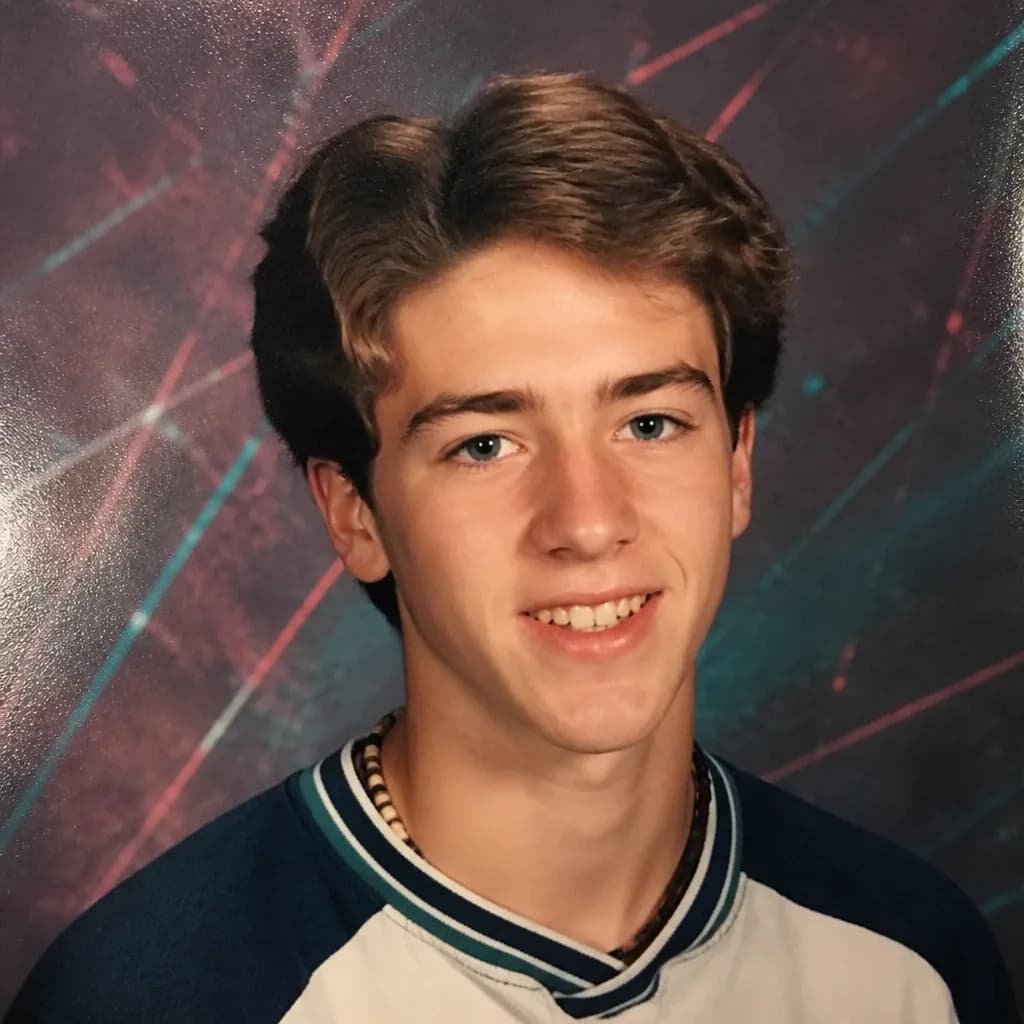 Young adult restyled as a 1997 yearbook portrait with laser backdrop
